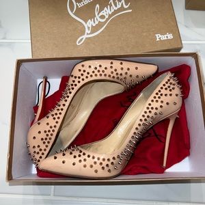 Beautiful nude spiked Louboutin heels, matches any occasion!